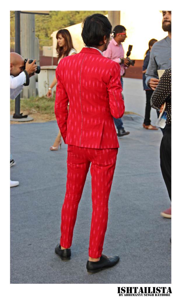 Jiten Thukral, one hal of artist duo 'Thukral & Tagra'. His suit styles are always quirky and I love this red burst of color here.