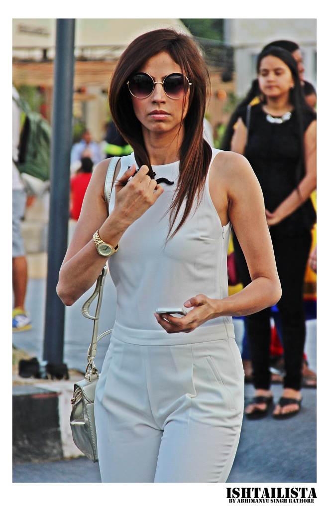 White jumpsuit styled with round frames and watch looks very coporate chic. This works perfectly for board meetings to formal functions.