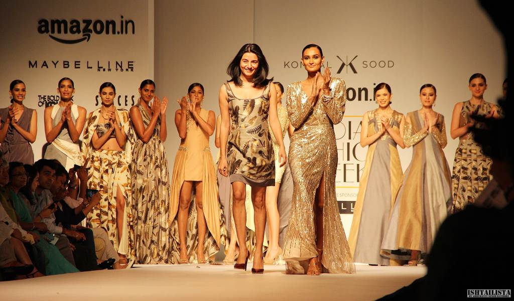 Designer Kommal Sood taking the bow in one of her creations with showstopper Rachel Byros.